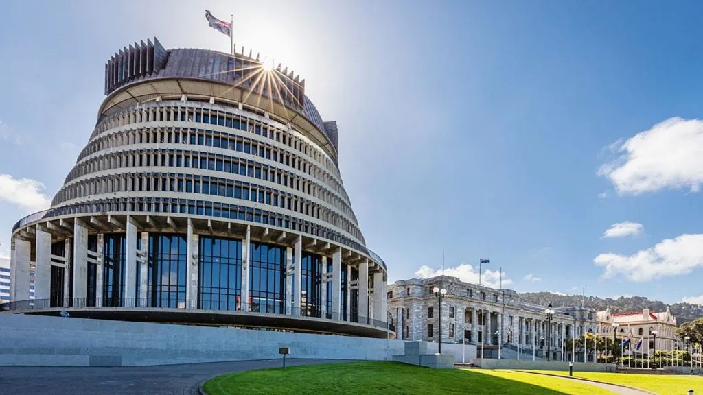 The Beehive and Parliament House in Wellington on a sunny day